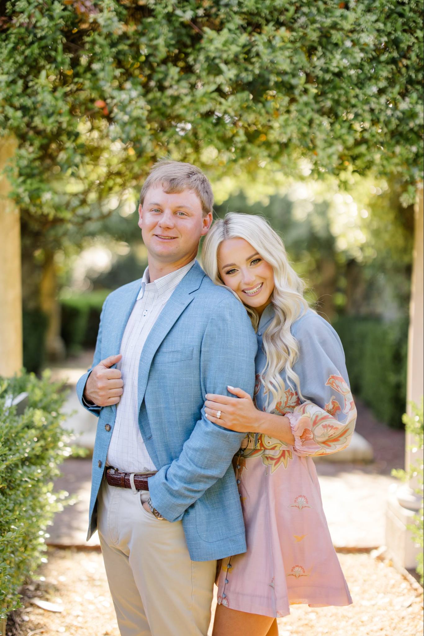 Gift-wrapped bridal presents with elegant bows and a handwritten card for Caroline Lovein and Clay Peters' wedding registry at Shoppes on Davis.