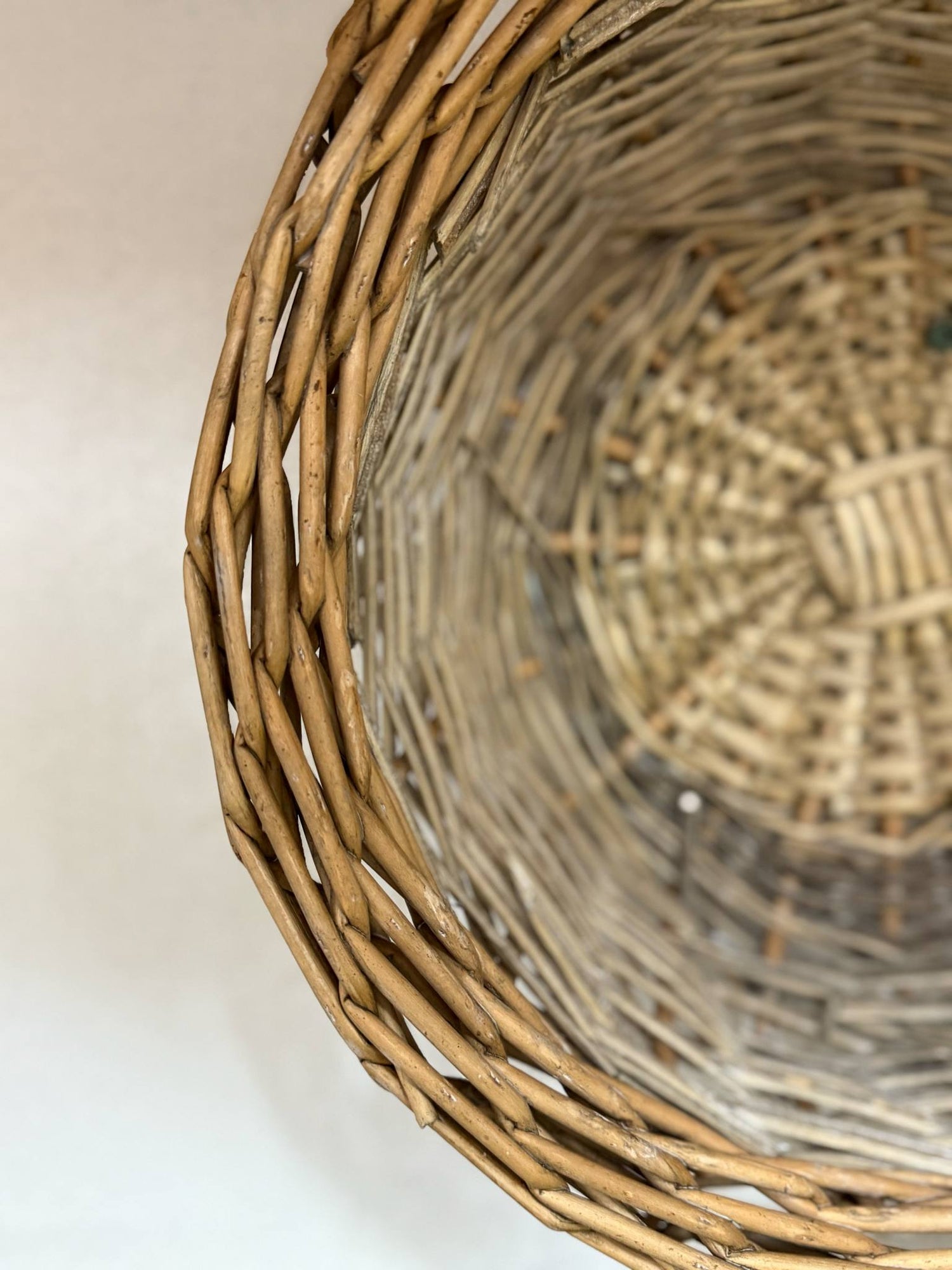 Close-up view of a woven wicker basket showcasing its natural texture and intricate weaving pattern, ideal for home décor, tabletop styling, or gift presentation.